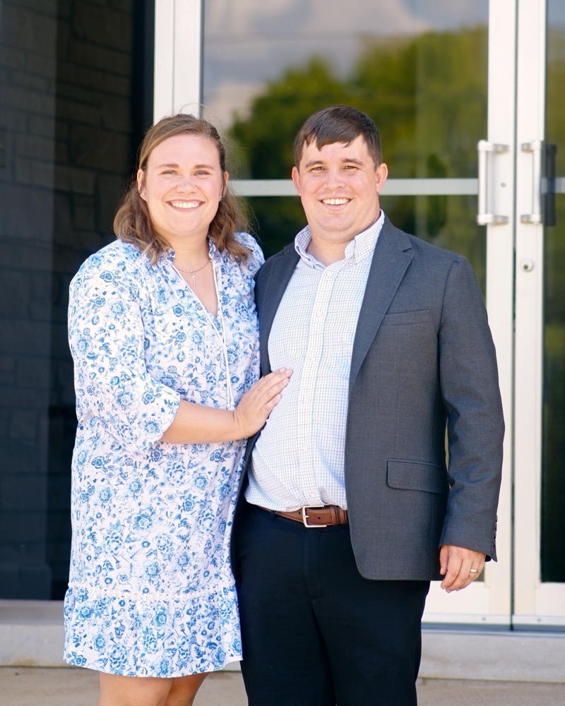 Bro. Austin Lane and his wife on the steps of the church